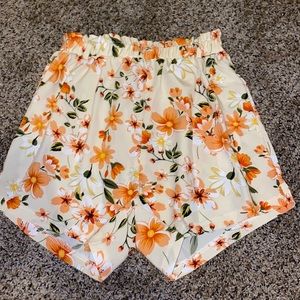 Orange floral shorts with belt. Never been worn in mint condition